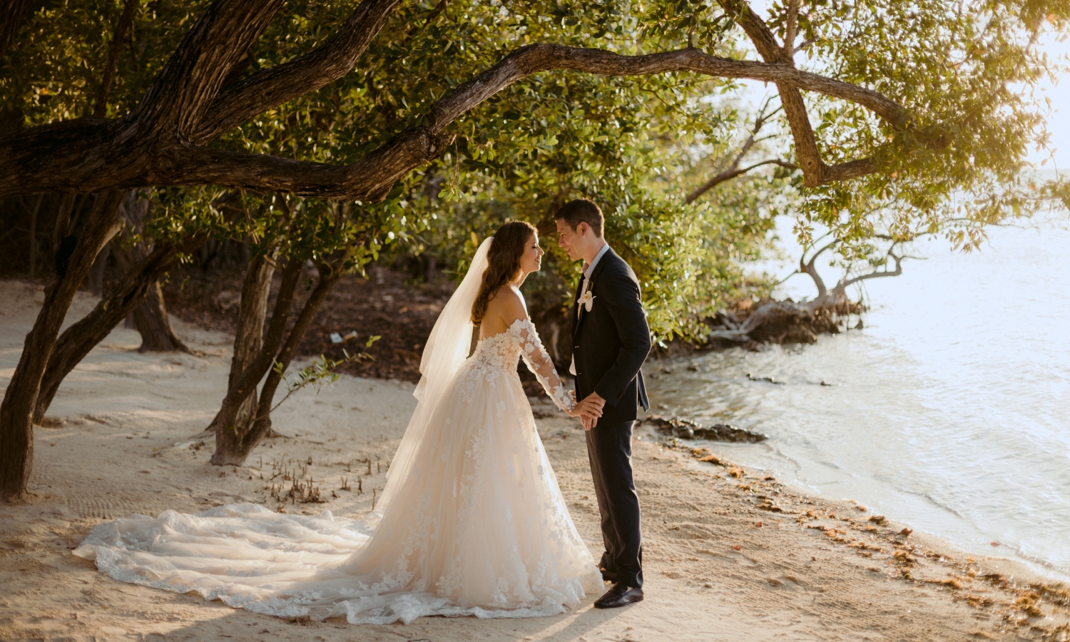 a bride and groom holding hands