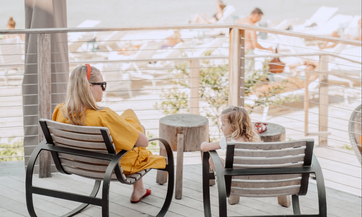 a woman and a child sitting outside
