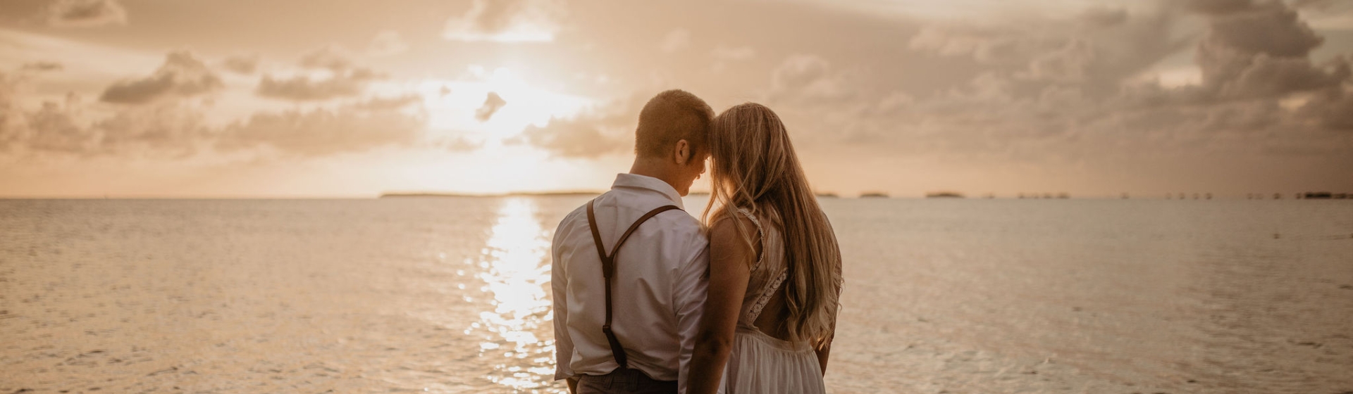 couple on beach at sunset
