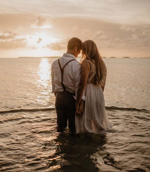 couple on beach at sunset