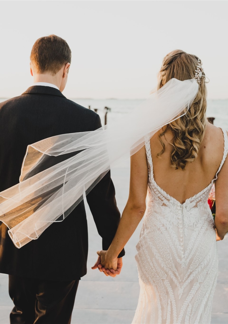 a groom and a bride holding hands