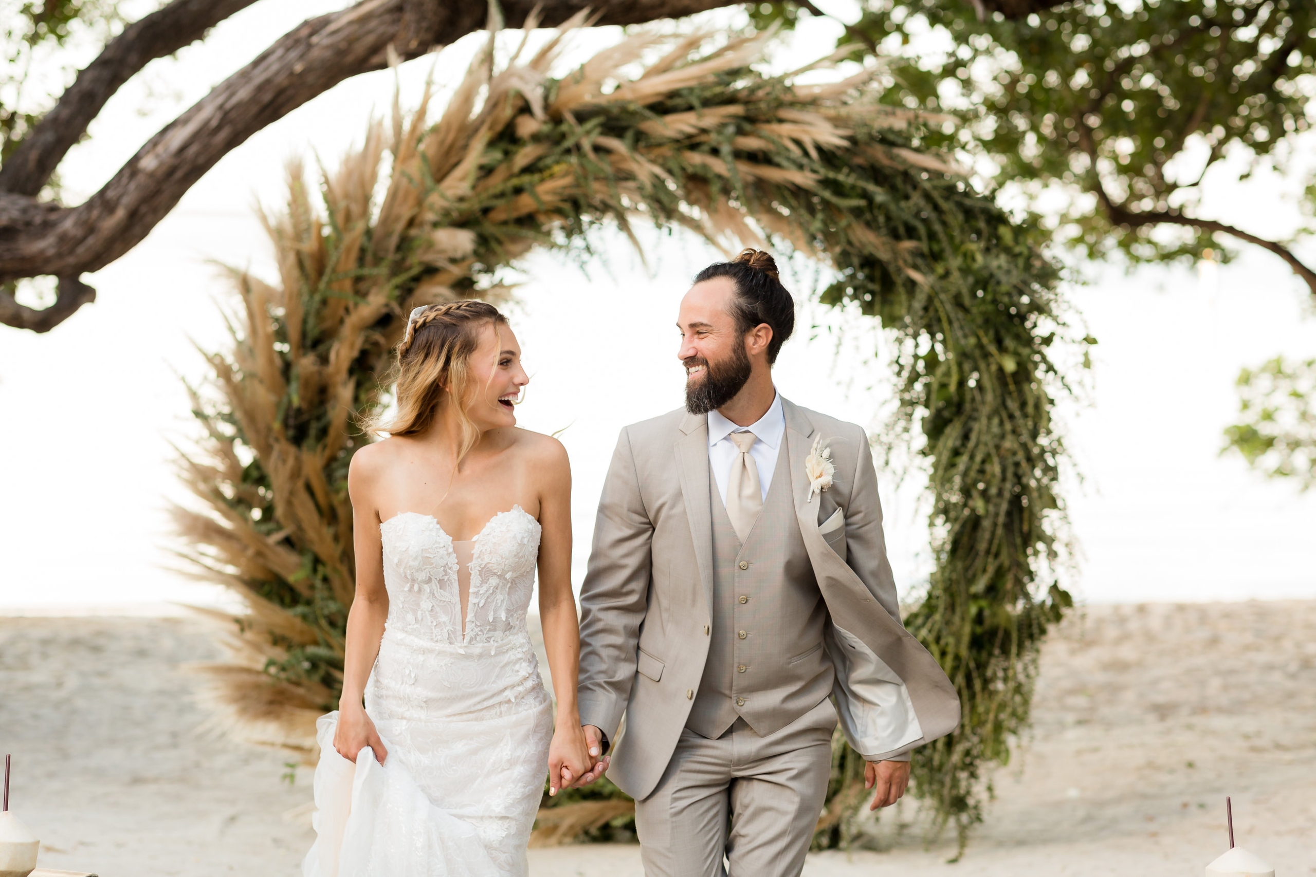 a bride and a groom holding hands