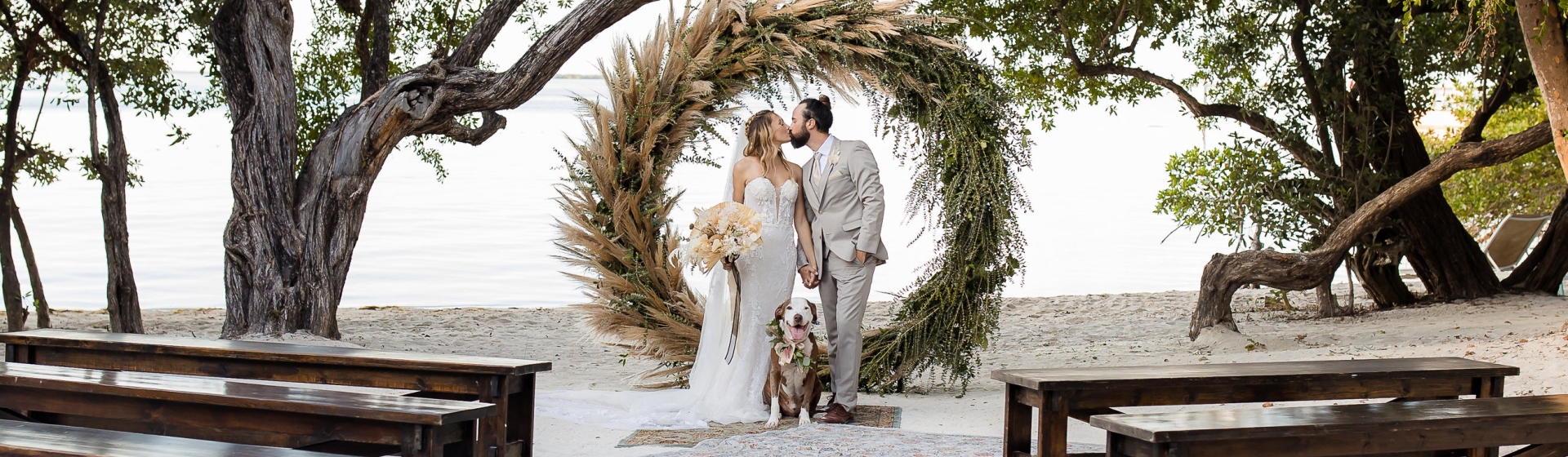 a couple kissing at a wedding