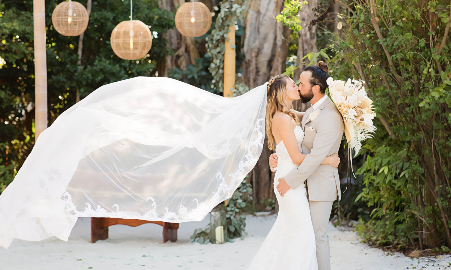 a bride and groom kissing