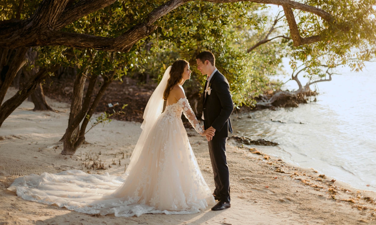 A bride and groom holding hands