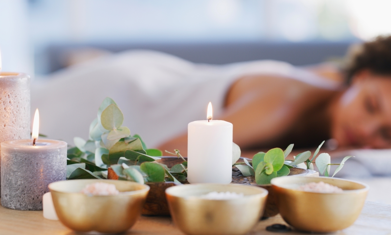 Relax, spa and zen woman with candles for beauty, physical therapy or skincare. Female client on table with candle in ambient room for cosmetics or luxury treatment for skin, health and wellness