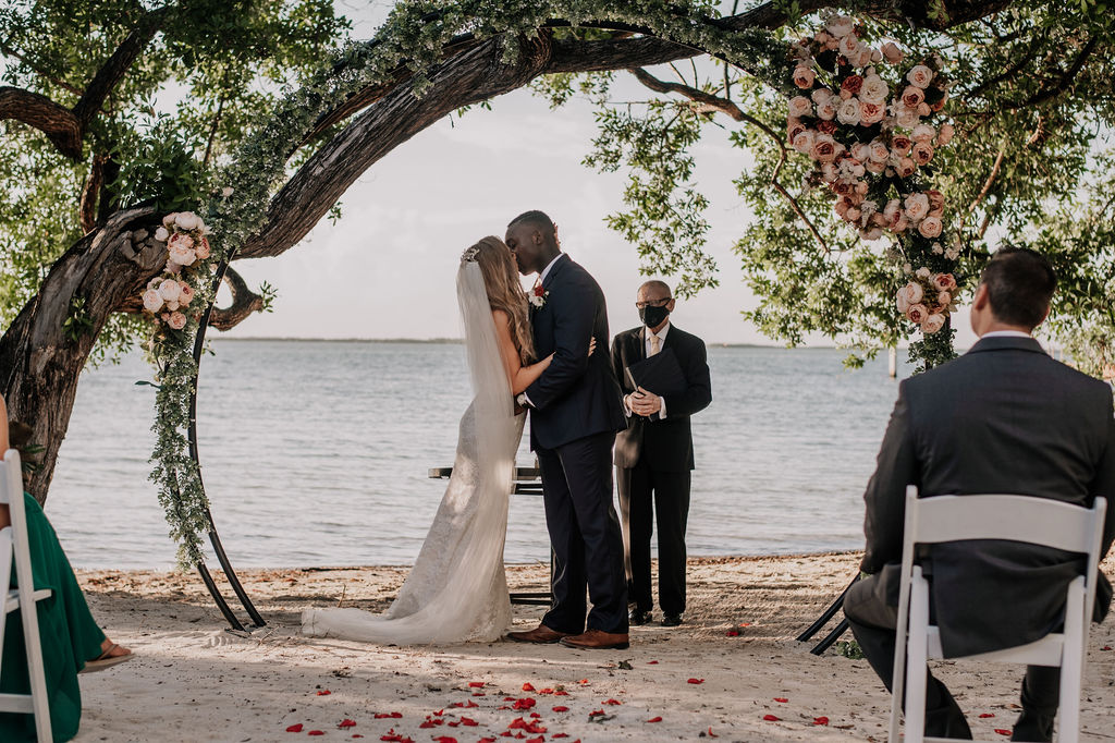 A bride and grooms first kiss