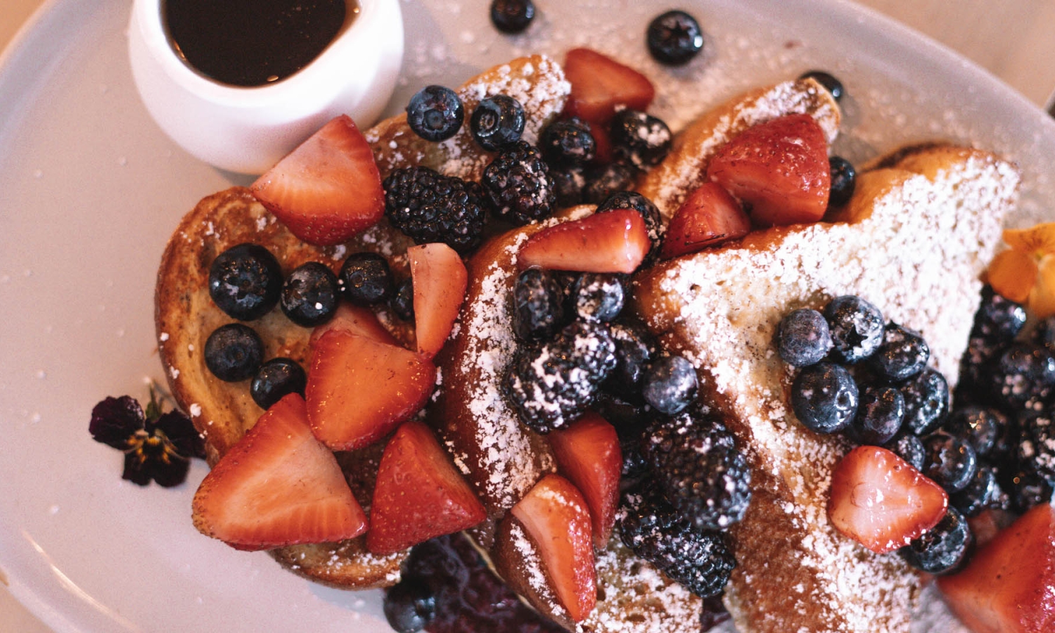 breakfast spread with french toast and berries
