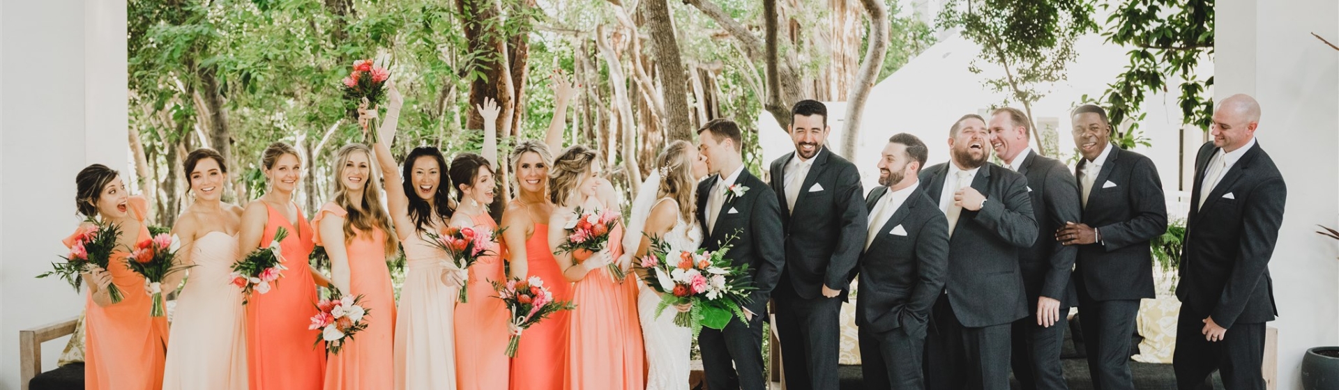 A wedding party posing for pictures