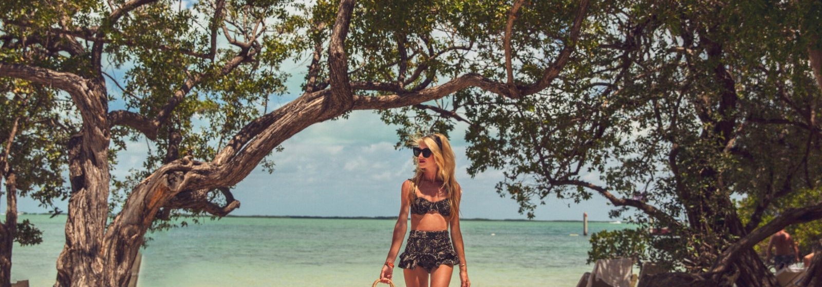 a woman walking on the beach