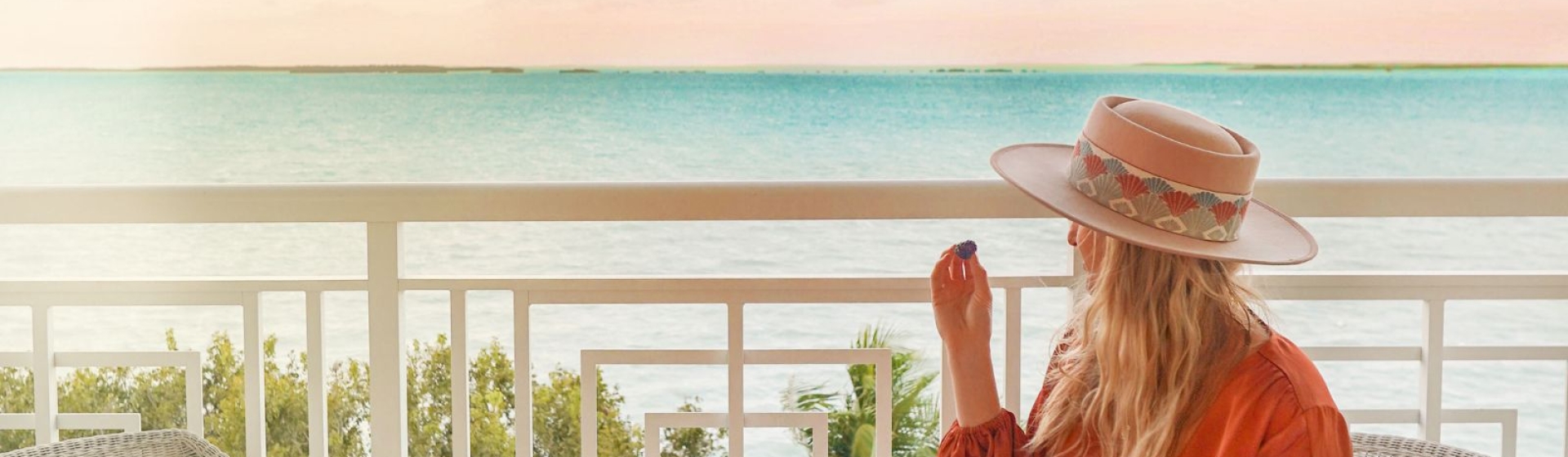 a woman looking out into the water at Baker's Cay Resort