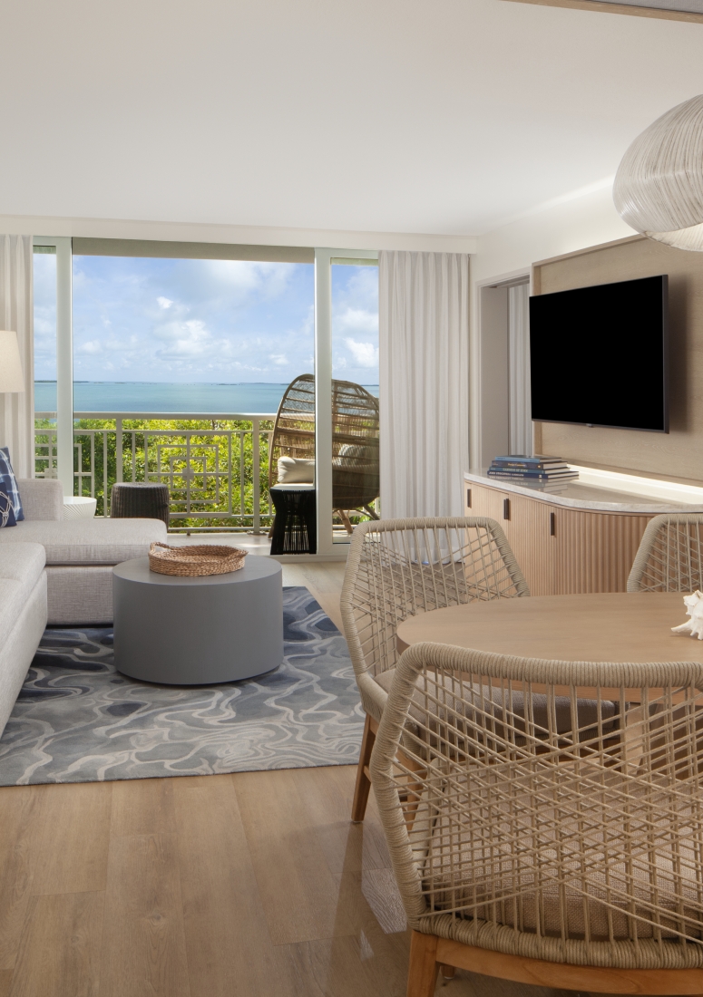 living space with tv and balcony