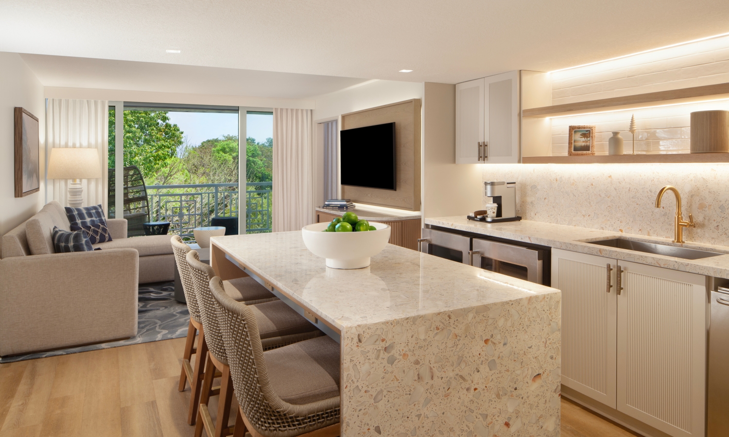 suite living space with comfortable seating and kitchen
