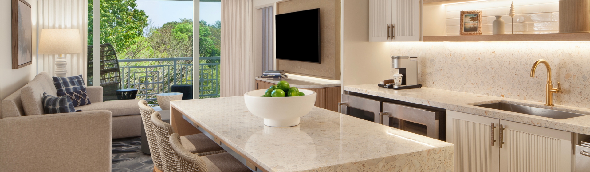 suite living space with comfortable seating and kitchen