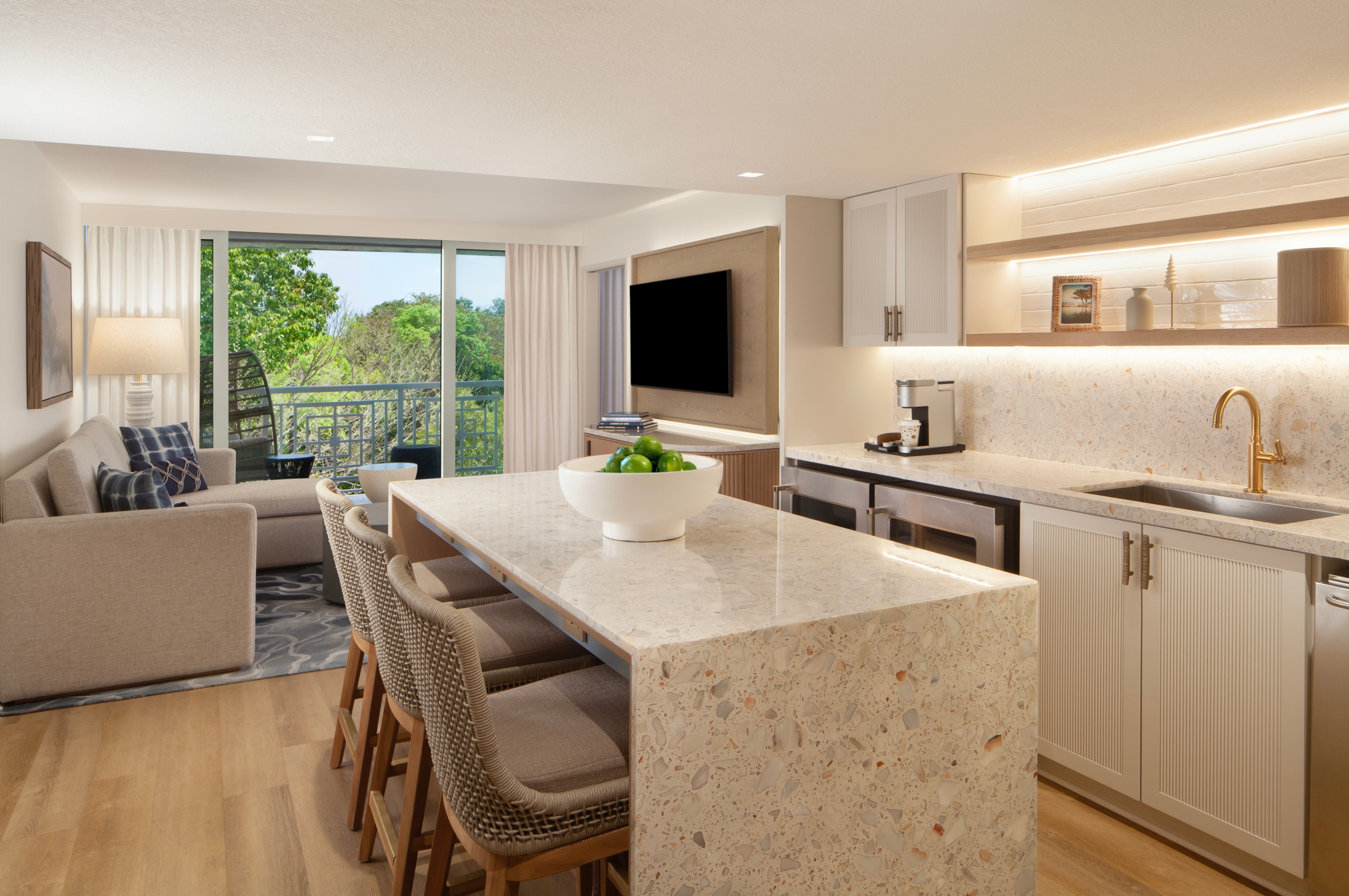 suite living space with comfortable seating and kitchen