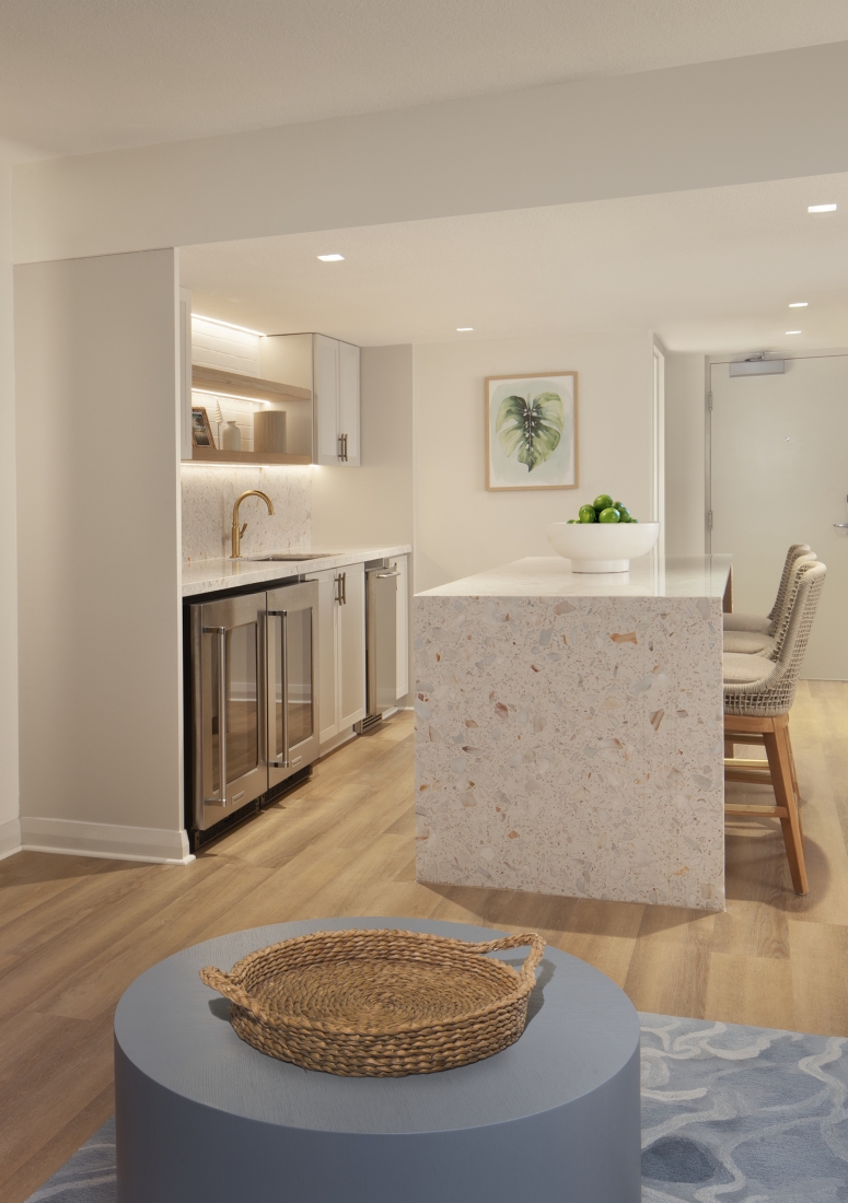 suite living space with tv and kitchen